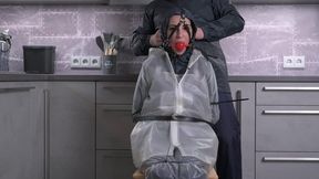 Amira in Regatta rainwear and transparent bibpants and raincoat hard gagged