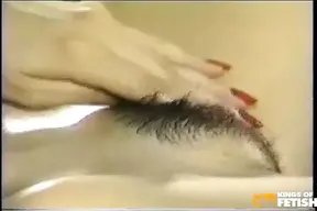 Gorgeous Asian Girl Plays with Her Hairy Pussy on the Bed