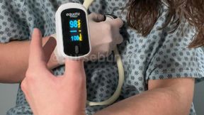 Pulse Oximeter and White Stethoscope Stimulation Testing with Vibrator in Patient Gown 1080p