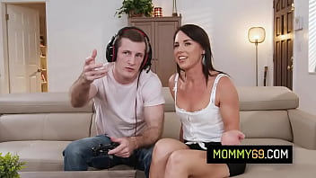 Brunette stepmom Riley Jacobs convince her stepson that fucking a pussy is better option that playing video games