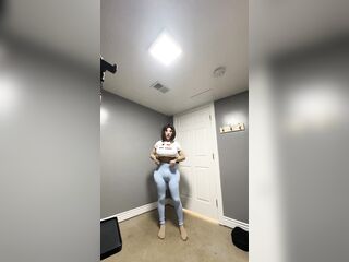 Sexy trans CD in Constricted blue leggings doing some yoga wit her beloved shirt