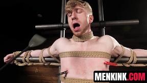 Kyler Drake makes Jesse Stone bite a gag as he drips sexy wax over him