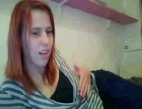 I am a classy redhead and I like to show off my yummy tits on webcam