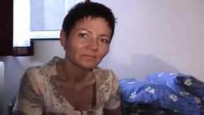 Short haired German lady pleasing her hairy muff with a dildo