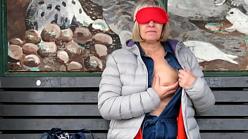 Daring public blindfold flashing