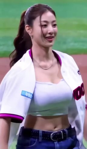 Sporty cheerleader in baseball uniform
