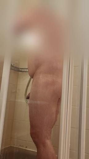 Guy showering in hotel