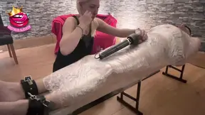 Mistress humiliates submissive with vibrating cage