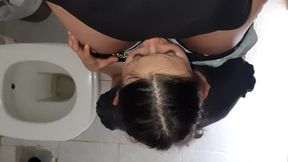 Seductive lesbian scene in a public restroom