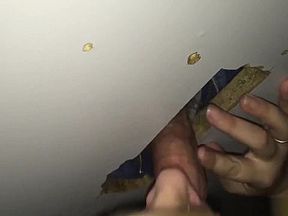 Wife having some fun with a stranger's cock in the glory hole