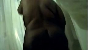 Dark skin amateur BBW aunty in the shower room on cam