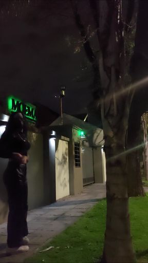 Crossdresser public walk wearing leather pants