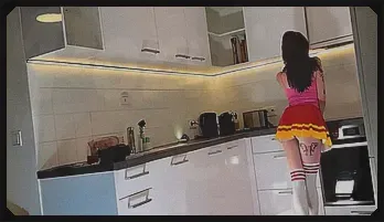 Sultry Redhead Cheerleader Spills Her See-Through Panties in Kitchen