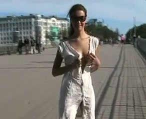 Slim teen gal flashing her titties and pussy in public