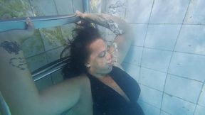 Underwater Seduction: Graceful Bubble Blowing in Wet Dress