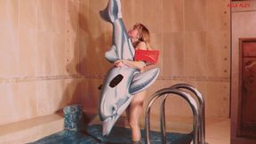 Alla quickly deflates a small inflatable dolphin in the pool!!!