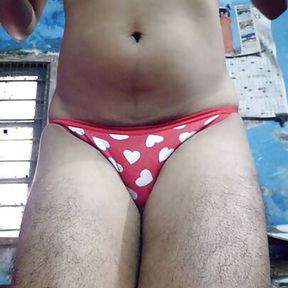 Indian teen boy wearing sports bra and red heart panty