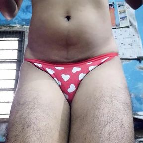 Indian teen boy wearing sports bra and red heart panty