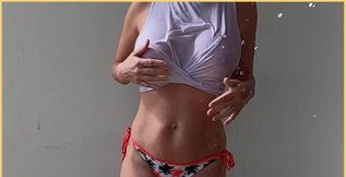 Sexy wet white shirt getting hosed down in slow motion