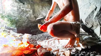 Hairy uncut guy jerks his big dick outdoors by the fire