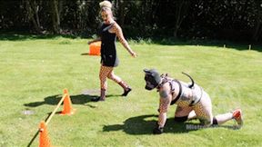 Human puppy training: Nikki Whiplash trains her female agility pup to complete the outdoor agility course WL1776