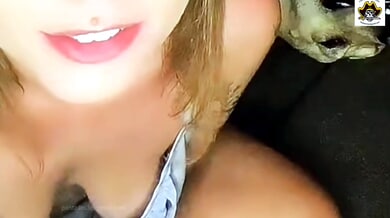 Small-titted chick flashes her shaved pussy and jerks off during a downblouse broadcast