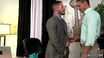 Latino stud takes a huge cock in the office