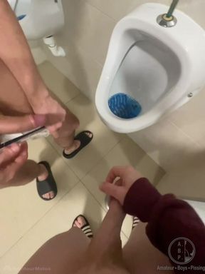 2 Boys Having Fun at the Pool Public Toilets' Urinal