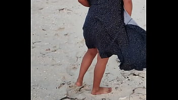 Hot Latina whore flashes her pussy and ass on a public beach in Mexico