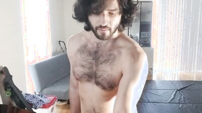 Handsome stud with hairy chest and long hair works out naked