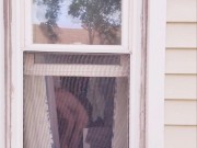 Neighbor Twink using dildo on ass and mouth in window