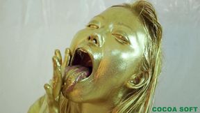 Asian in gold paint pleasured