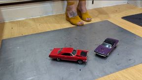 Giantess Atari queen destroys a Plymouth Road Runner & Dodge Challenger toy car crush in sexy yellow wedges close left view