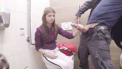 Gina Gerson blows a guy in the restroom and rides his dick