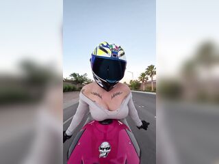 hot biker hotty does soaked t-shirt contest on her bike whilst riding