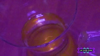Pissing inside a vase during a sex party