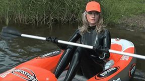 Rubber blonde in latex catsuit and kayak adventure