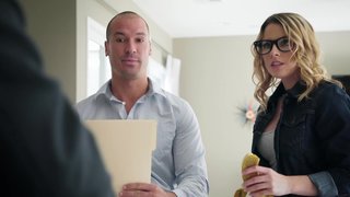 A girl that has her nerdy glasses on is getting licked in the kitchen