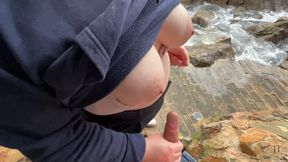 Huge cumshot after handjob by the sea