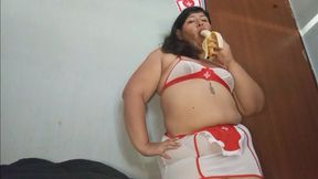 Naughty nurse playing and eating banana