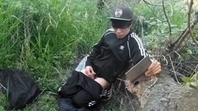Cute Asian gay twink in a black-and-white adidas tracksuit and Campus sneakers masturbates and cums outdoors