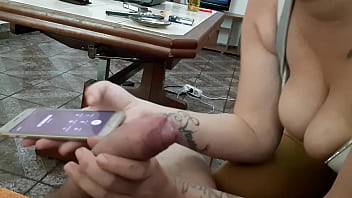 She sucks her while she talks to her boyfriend on the phone