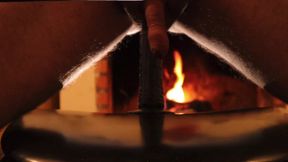 Dildo in front of the fireplace