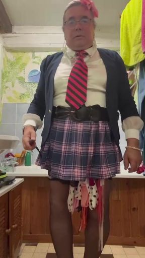 In an outfit with a little plaid skirt to pee in a bottle