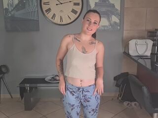 Brunette explaining every tattoo piece on her rocking body.