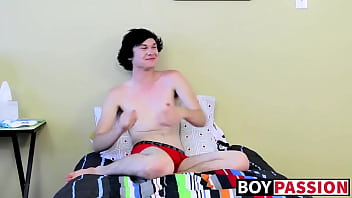 Twink tugs on his massive cock and uses dildo on his ass