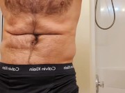 Muscle bear flexing in Calvin Klein underwear