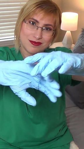 Nurse tries on exam gloves