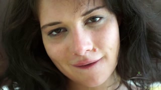 Hairy brunette Izzy Champayne gives you a striptease and spreads her gaping pussy