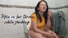 Mia on her throne while smoking